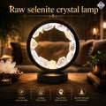 Raw selenite crystal lamp on a wooden surface with a cozy indoor background